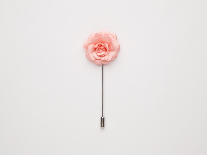 A single pink flower on a white background.