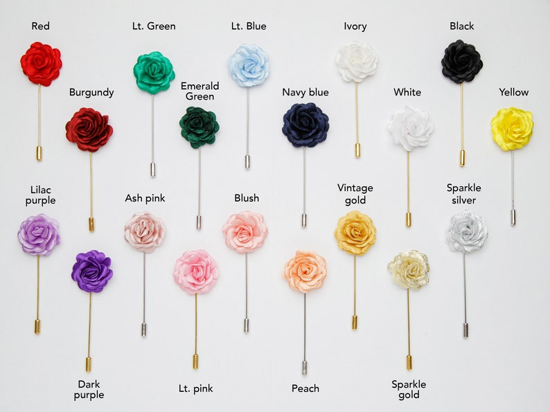 May include: Assortment of 18 silk flower lapel pins in various colors, including red, green, blue, ivory, black, burgundy, emerald green, navy blue, white, yellow, lilac purple, ash pink, blush, vintage gold, sparkle silver, dark purple, light pink, peach, and sparkle gold.