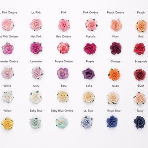 May include: A chart of 24 small fabric flower embellishments in various colors and ombre shades, including light pink, hot pink, red, lavender, purple, white, ivory, ecru, sand, nude, blush, yellow, baby blue, and navy.