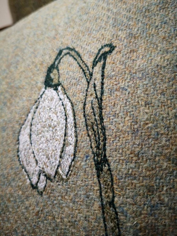 Snowdrop embroidered Harris Tweed cushion cover