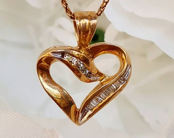 Vintage diamond heart pendant in 10ct gold. Unworn old stock.