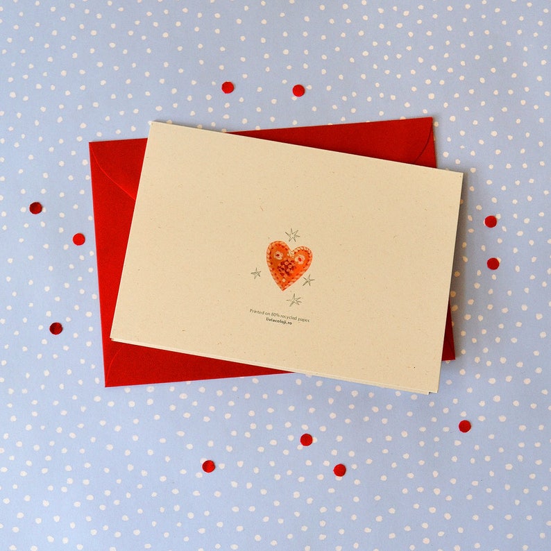 May include: A blank greeting card with a red envelope. The card has a small, orange heart with white stars on a cream background. The text on the card reads "friends are always special people" and "thefriendship.co.uk".
