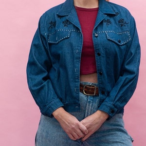 Jean jacket with roses and rhinestone detail