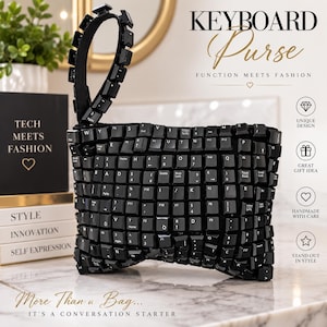May include: A black rectangular purse constructed from individual computer keyboard keys. The bag features a matching black wrist strap also made of keyboard keys. The surface is covered in various alphanumeric and function keys in black.