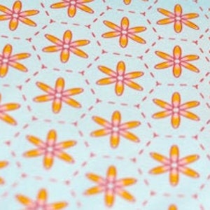 May include: A repeating pattern of orange flowers with pink centers on a light blue background. The flowers are outlined in a thin pink line.