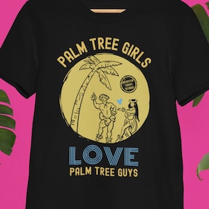 May include: Black t-shirt with a yellow circle graphic featuring a palm tree, a man and a woman, and the text "Palm Tree Girls Love Palm Tree Guys".