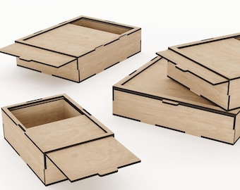 May include: Three wooden boxes with lids. The boxes are made of light brown wood and have black edges. The lids are open and the boxes are stacked on top of each other.