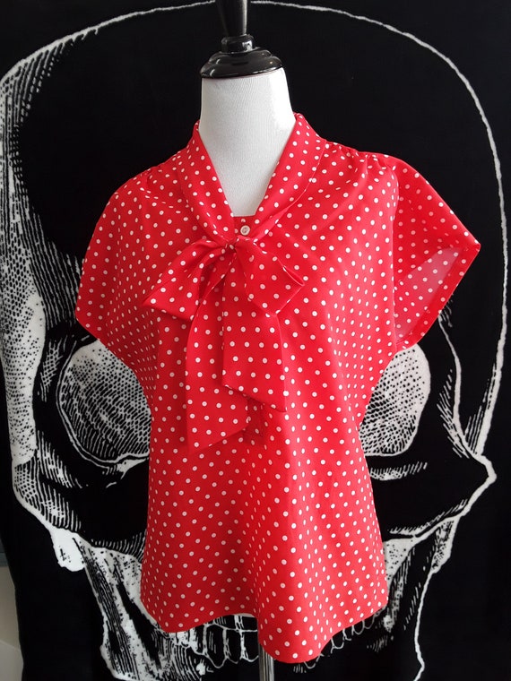 red and white polka dot blouse