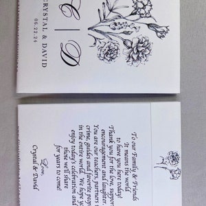 May include: A white wedding invitation with black text and a floral design. The text reads "Crystal & David" and "06.22.24". The invitation includes a message thanking guests for their support and wishing them well.