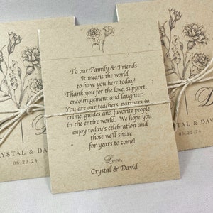 May include: A brown card with a floral design and the text "To our Family & Friends It means the world to have you here today! Thank you for the love, support, encouragement and laughter. You are our teachers, partners in crime, guides and favorite people in the entire world. We hope you enjoy today's celebration and those we'll share for years to come! Love, Crystal & David"