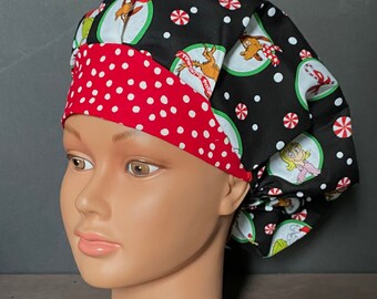 May include: A black and red scrub hat with a white polka dot pattern. The hat features a green and white print of characters from the book "How the Grinch Stole Christmas!" The text "You're a mean one, Mr. Grinch" is visible on the hat.