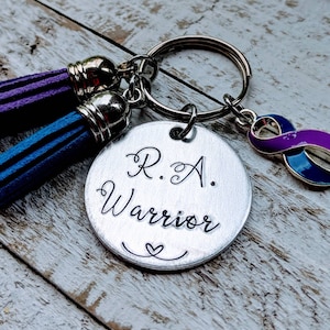 Rheumatoid Arthritis Awareness Keychain with RA Warrior Phrase and Ribbon Design in Blue and Purple