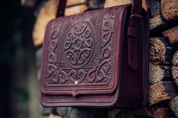 purple leather messenger bag