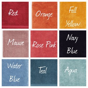 May include: Nine different colored towels, each with a different color name written on it in white text. The colors are red, orange, yellow, mauve, rose pink, navy blue, water blue, teal, and aqua.