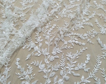 Newest arrival fashion wedding dress lace fabric ivory fashion gown dress lace with beading and sequins sell by yard