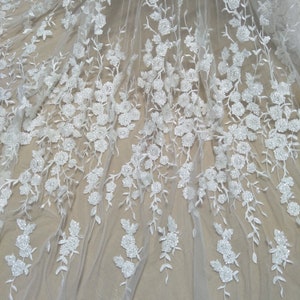 Highly quality ivory beaded wedding dress lace fabric 130cm width bridal lace tulle lace fabric with beads sell by yard