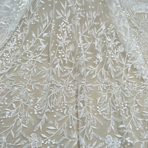 Hot selling fashion bridal wedding lace fabric 130cm width dress lace couture lace ivory fabric 130cm width sell by yard