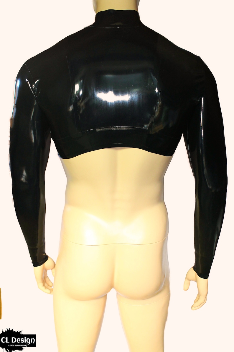 May include: A black, long-sleeved, cropped top made of shiny latex. The top has a high neck and a close fit.