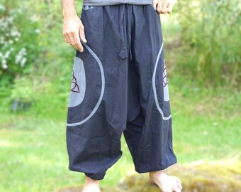Baggy pants, harem pants with embroidered triskele made of strong cotton fabric in different colors.