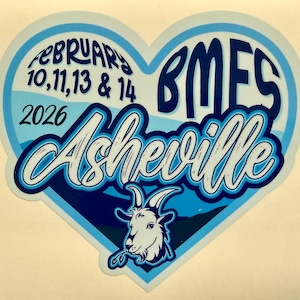 May include: A heart-shaped sticker with a light blue and dark blue design. The sticker features the text "February 10, 11, 13 & 14 2026 Asheville" in a stylized font. A goat illustration is at the bottom. The letters "BMFS" are at the top right.