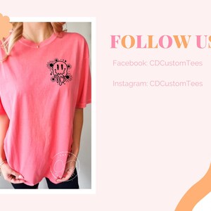 May include: A pink t-shirt with a black graphic of a melting smiley face surrounded by flowers. The text "Good Vibes Only" is inside the smiley face.