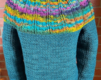 May include: A teal blue crocheted sweater with a colourful geometric pattern around the neckline.