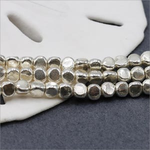 HSTR03 ~ Hill Tribe Silver, 3-Sided Shiny Bead, 4 inch long strand, Approximately 30 beads, Price per Strand