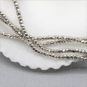 HSTR14 ~ Hill Tribe Silver Bead Strand, Tiny Faceted Beads, 1.2mm x 1.5mm, 13.5 inch strand, Approximately 250 beads, Price per Strand