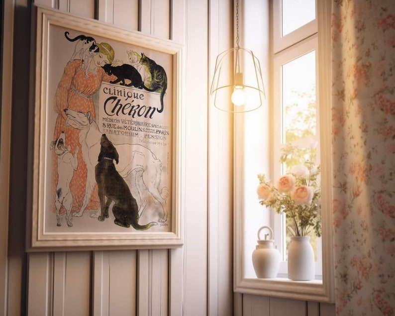 May include: A vintage framed poster advertising a veterinary clinic called "Clinique Ch&eacute;kon" with a woman and several animals, including a dog, cat, and a rabbit. The poster is in a white frame and is hanging on a white wood panel wall.