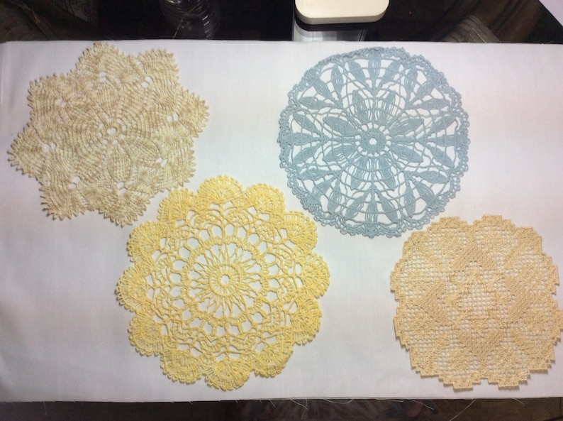 Doilies look like hand crocheted machine embroidered