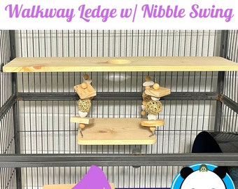 May include: A wooden walkway ledge and swing set for small pets, with a natural wood finish. The set includes a platform, a ledge, and a swing with a woven ball and wooden beads. The set is designed to be hung from the top of a cage.
