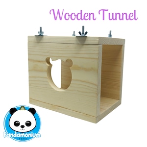 May include: Wooden tunnel for small animals, made of natural wood with a bear-shaped cutout. The tunnel is assembled with metal screws and has a light wood finish.