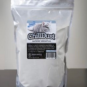 May include: A white bag of ChillDust bathing sensation for chinchillas. The bag has a black label with a picture of a chinchilla and the text "ChillDust Bathing Sensation".