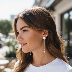 Silver flower dangling clip-on earrings