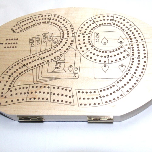 Cribbage Boards in various designs and Materials. Includes Pegs and