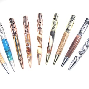 May include: A collection of ten pens with different colored and patterned barrels. The pens have silver, gold, and copper accents.