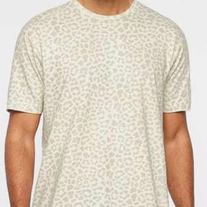 May include: A white t-shirt with a brown leopard print pattern.