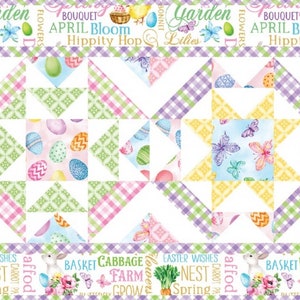 May include: A colorful quilt block pattern with a white background. The pattern features a repeating design of pink, green, and yellow squares with a star in the center. The quilt block is surrounded by a border of white and green squares with text that reads "Garden, Bouquet, April Bloom, Hippity Hop, Easter, Nest, Spring, Basket Cabbage, Farm, Grow, and Lille."