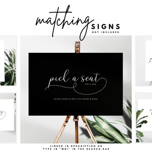 May include: A collection of wedding signs with elegant calligraphy. The signs include phrases like "Pick a Seat," "Open Seating," and "No Sides." The signs are displayed on easels with greenery in the background. The text "matching signs not included" is at the top.