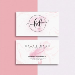 a business card with a pink and white background