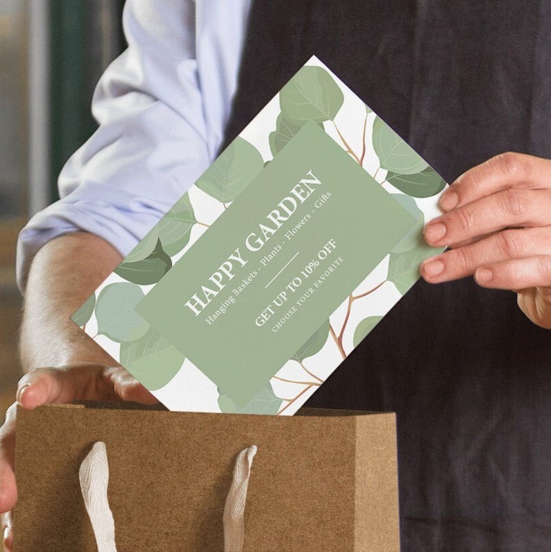 a person holding a card in a brown paper bag