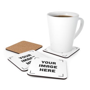 a cup of coffee and coasters on a white surface