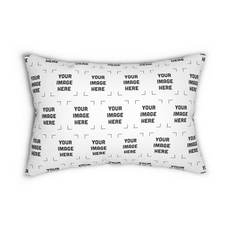 a white rectangular pillow with a black and white pattern