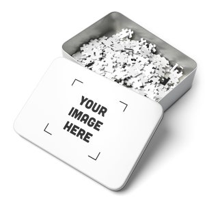 a metal container filled with white jigsaw pieces
