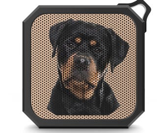 May include: Black and brown Rottweiler dog face printed on a small black square speaker with a brown mesh grill.