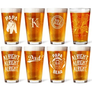 a set of six glasses filled with different types of beer