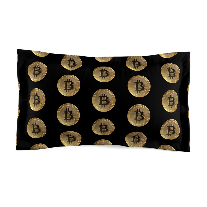 a pillow with a bitcoin pattern on it