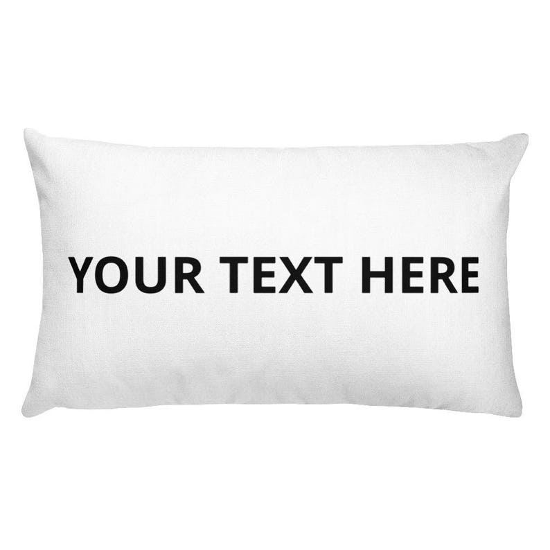 a white pillow with a black text on it
