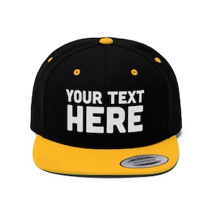 a black and yellow hat with a yellow visor