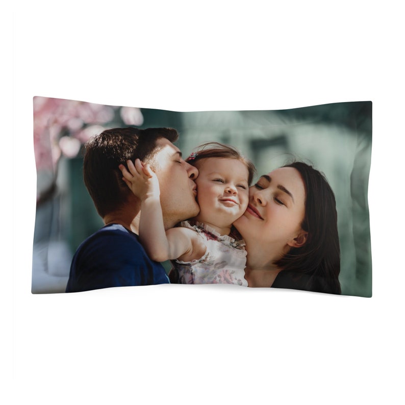 a pillow case with a photo of a family kissing each other